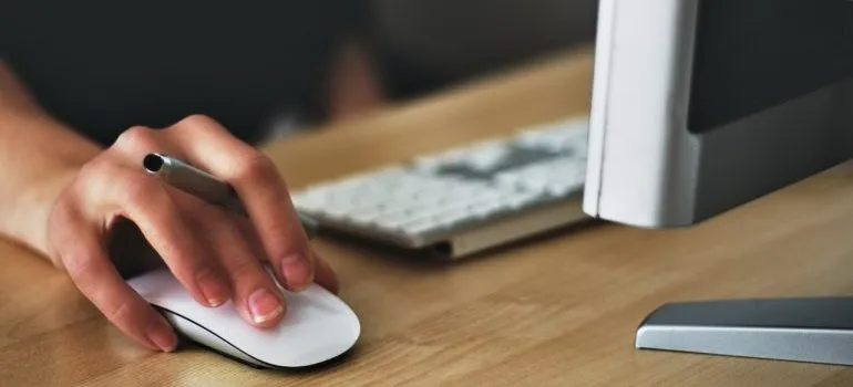 woman searching online for commercial movers Maryland