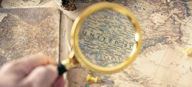 person using a magnifying glass