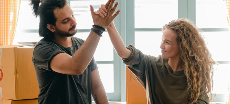 Couple high-fiving