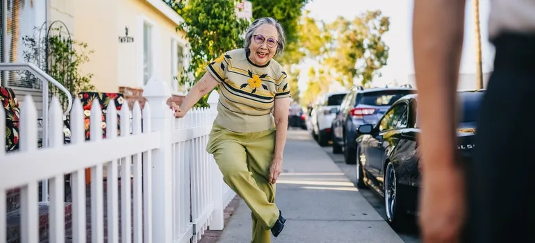 An Asian grandma is smiling.