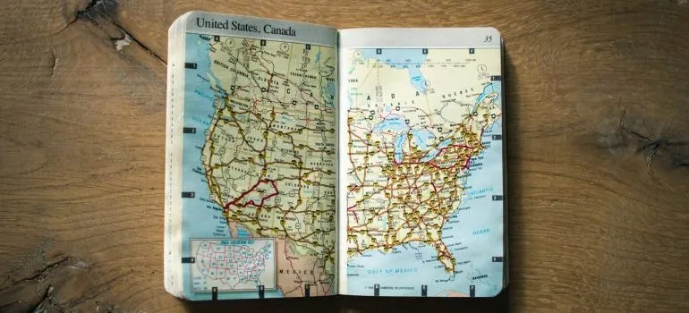 An atlas opened at the map of the US