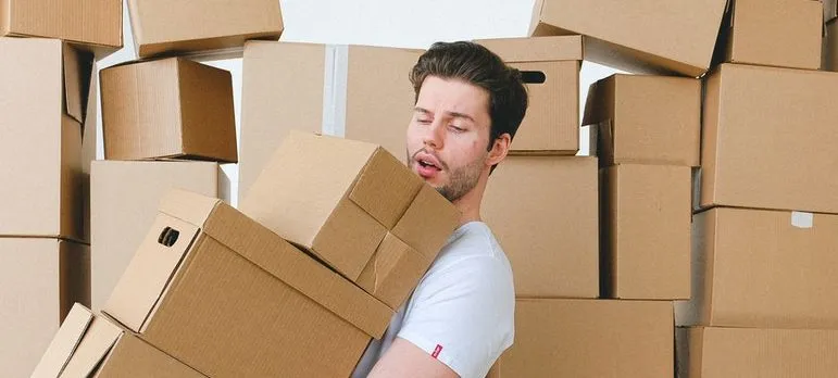 Man packing for moving from DC to NYC