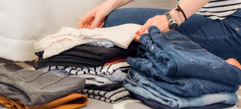 a girl decluttering her clothes