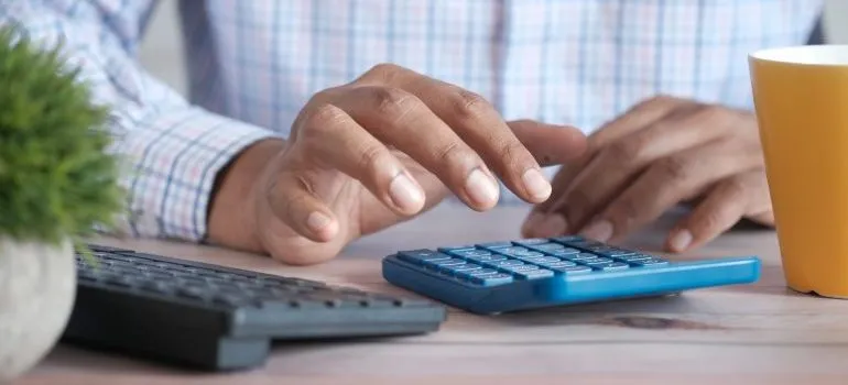 man calculating cost of Moving to West Virginia