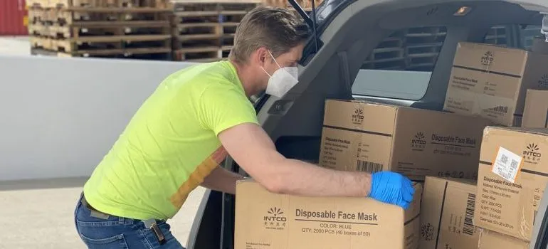 A man packing and helping students moving to DC