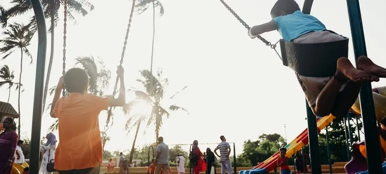 children playing on the swing