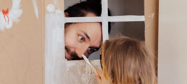 father and a daughter playing