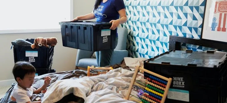 woman unpacking with a baby