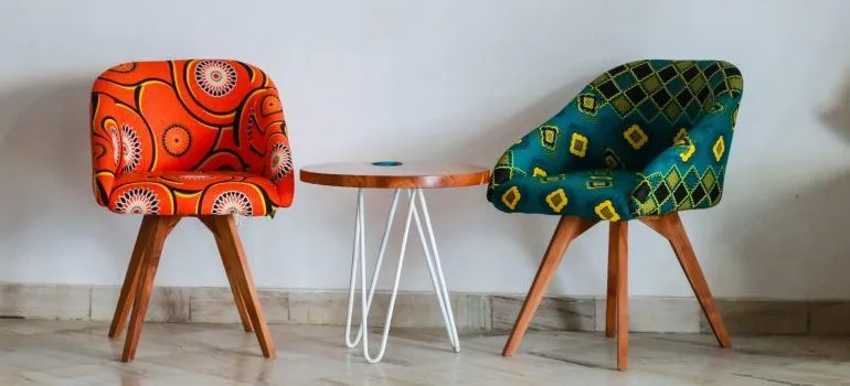 two padded chairs and a table