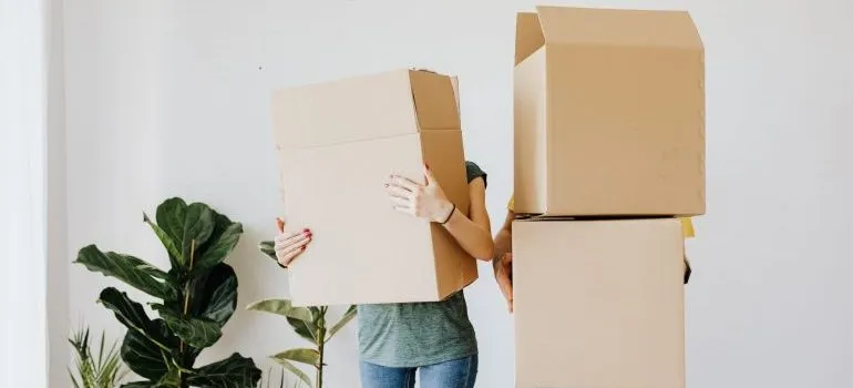 a couple holding boxes