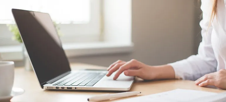 A person using a computer to find an apartment in Gaithersburg