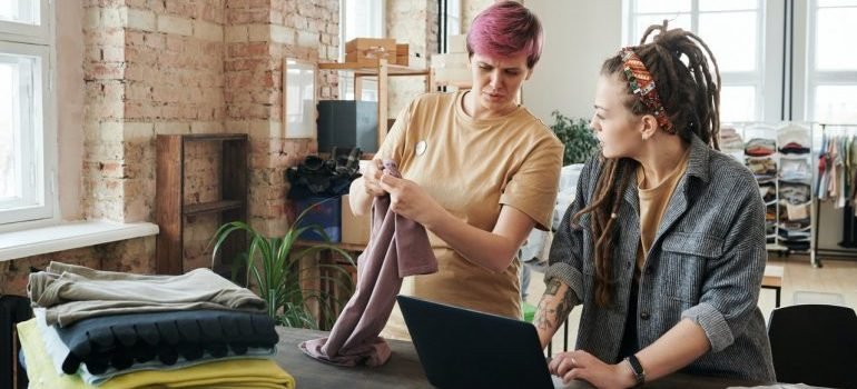 A woman sorting clothes.