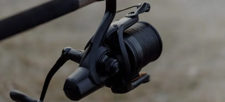 a fishing reel attached to a fishing rood