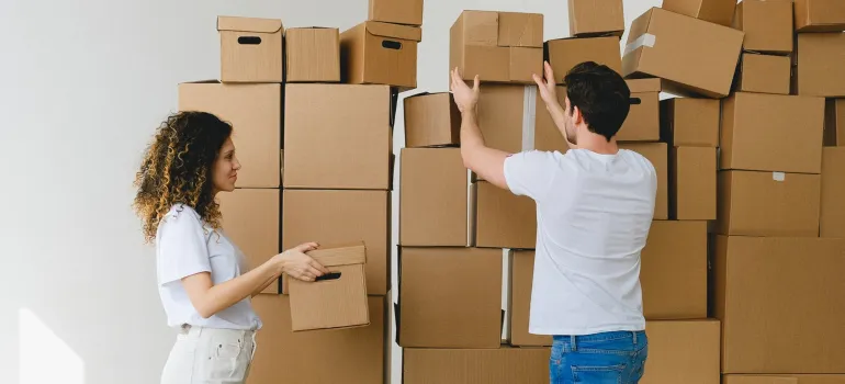 a couple packing a home before moving from Potomac to DC