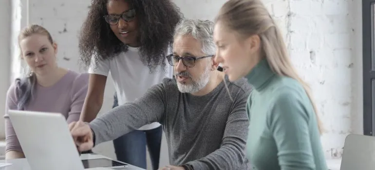 office coworkers discussing plans on how they should approach the moving process