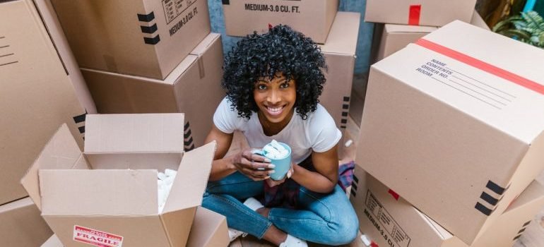 A young woman moving home