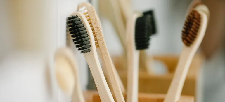 a stack of wooden toothbrushes