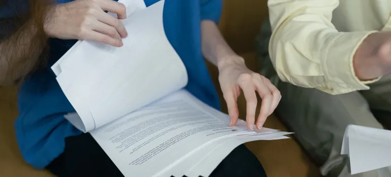 a woman going through paperwork to ensure they pack important files before Gaithersburg relocation