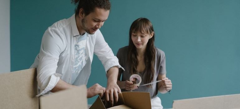 two people unpacking after the move
