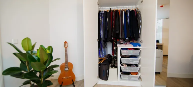 a picture of a wardrobe inside a home to depict packing your clothes for an interstate move
