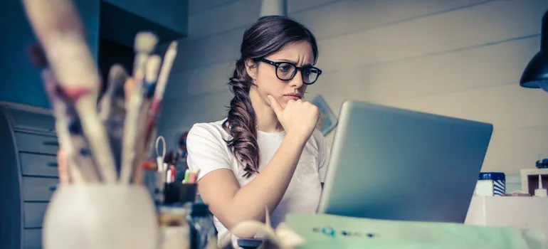 A woman researching online everything she needs to know when moving from Potomac to NC