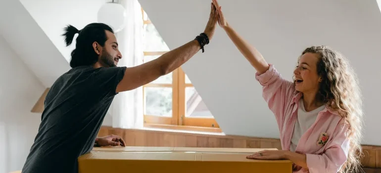 A woman and a woman with a box