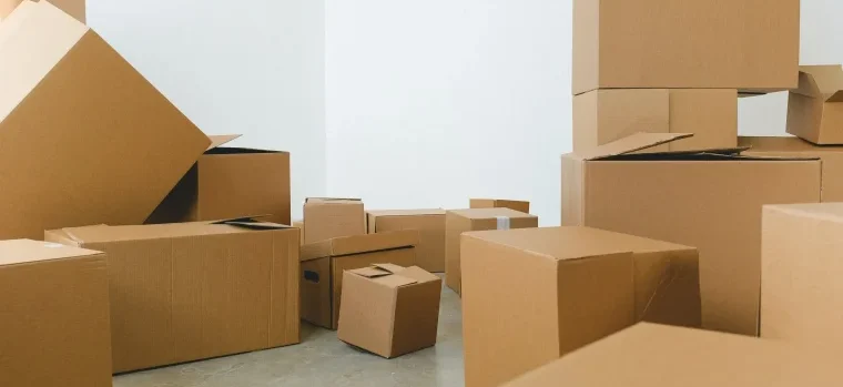 A pile of cardboard boxes on the floor