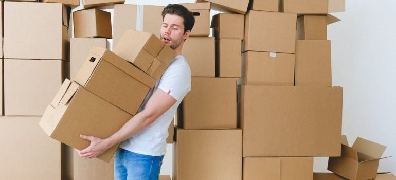 A man carrying boxes