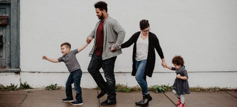 Family of four walking down the street