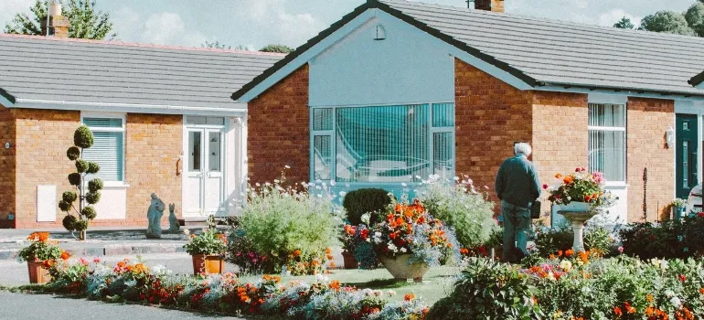 man in front of a house