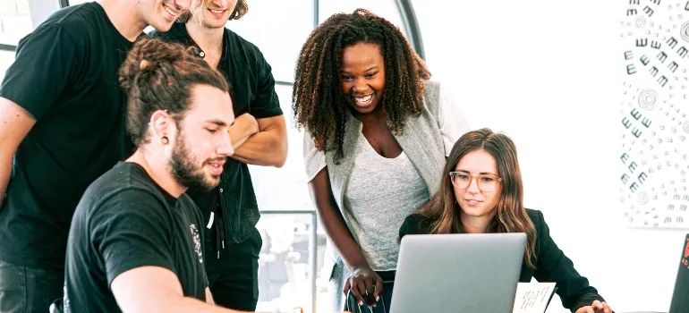 young people looking at the computer