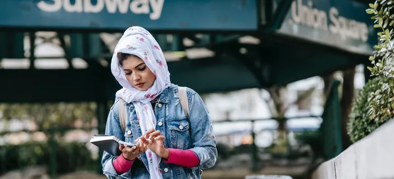 A person trying to orient herself and adapt to New York City after living in Washington