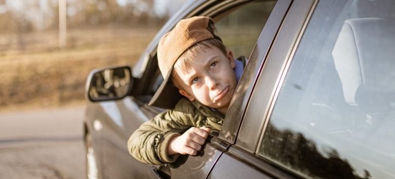 Kid looking from car window
