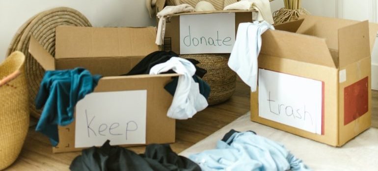 Labeled boxes to keep, donate or trash