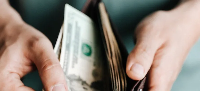 looking at a wallet and thinking about common reasons people move from Maryland to Virginia