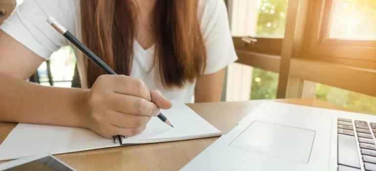 A girl writing and thinking about a stress-free move from Potomac to Germantown