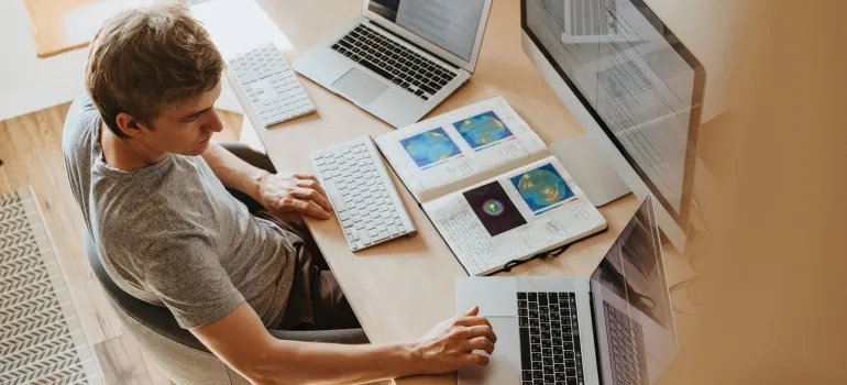 A man looking at a laptop