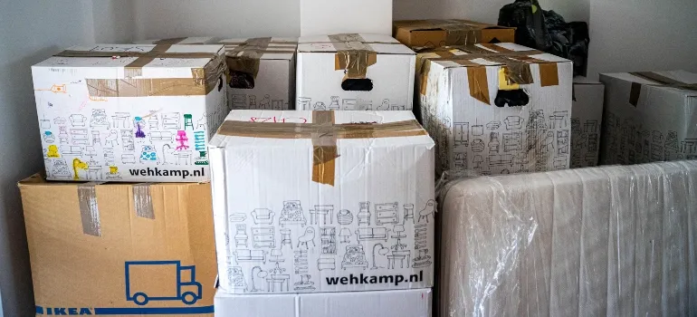 Packed boxes prepared for moving with a newborn