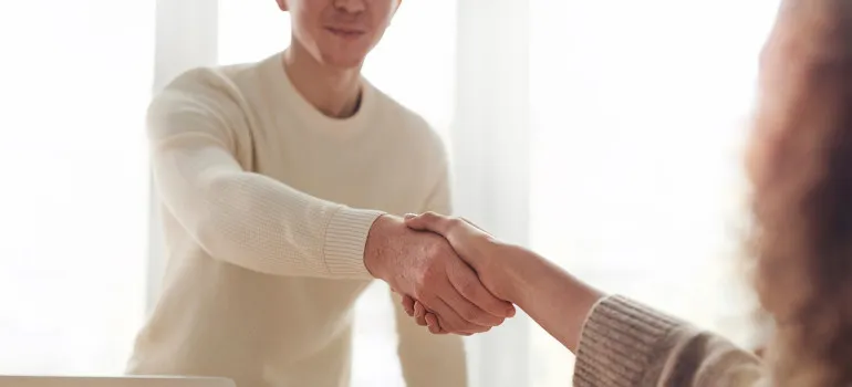 Man and woman shaking hands