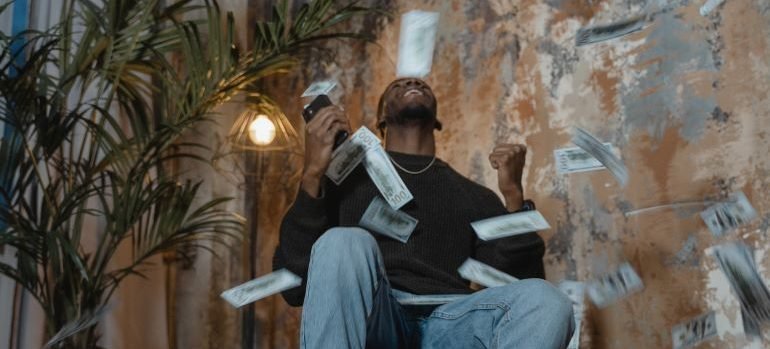 a man throwing money before and thinking about the move from Rockville to Silver Spring