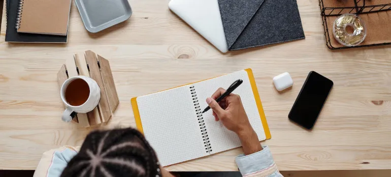 Person writing in a notebook