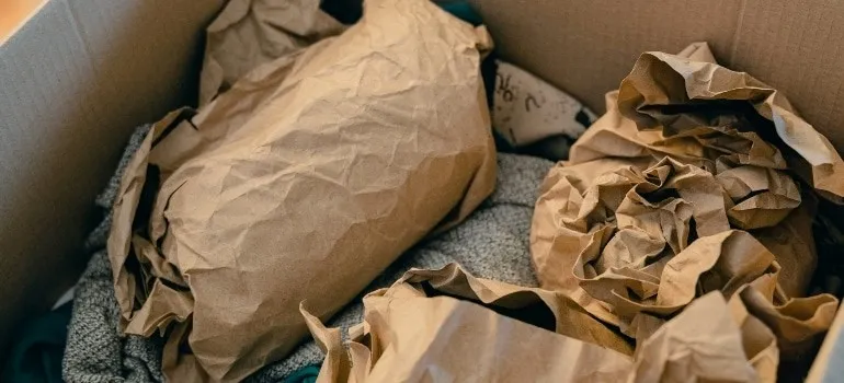 Items wrapped in paper and packed in order to save money when moving to Maryland