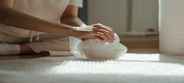 Packing fragile items in bubble wrap