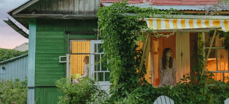 Two women in their home after leaving Maryland for Virginia