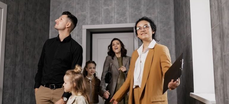 realtor and a family checking a property
