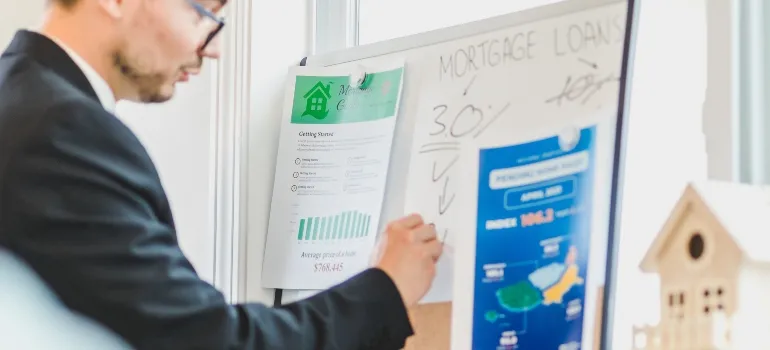 man looking at the graph as an example of a good plan you should make to sell your Maryland apartment quickly