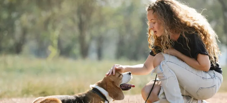 a girl with her dog in one of the best Places in Maryland dog owners move to