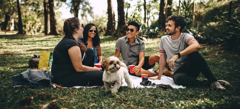 friends with dog at a park