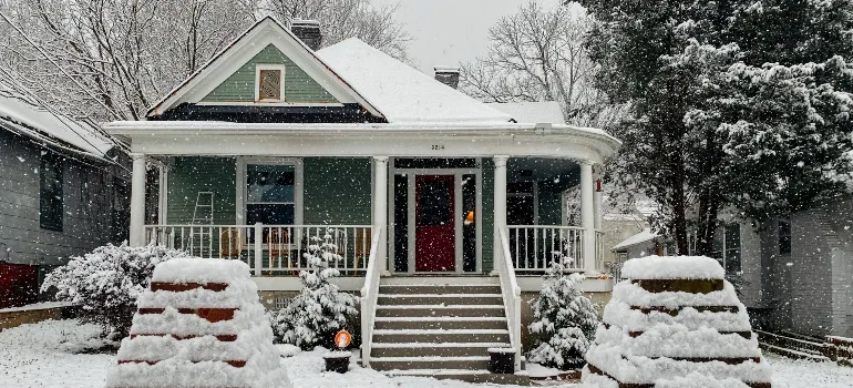 Suburban home covered in snow