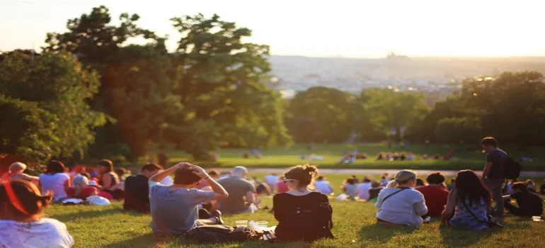 Group of people sitting in a park